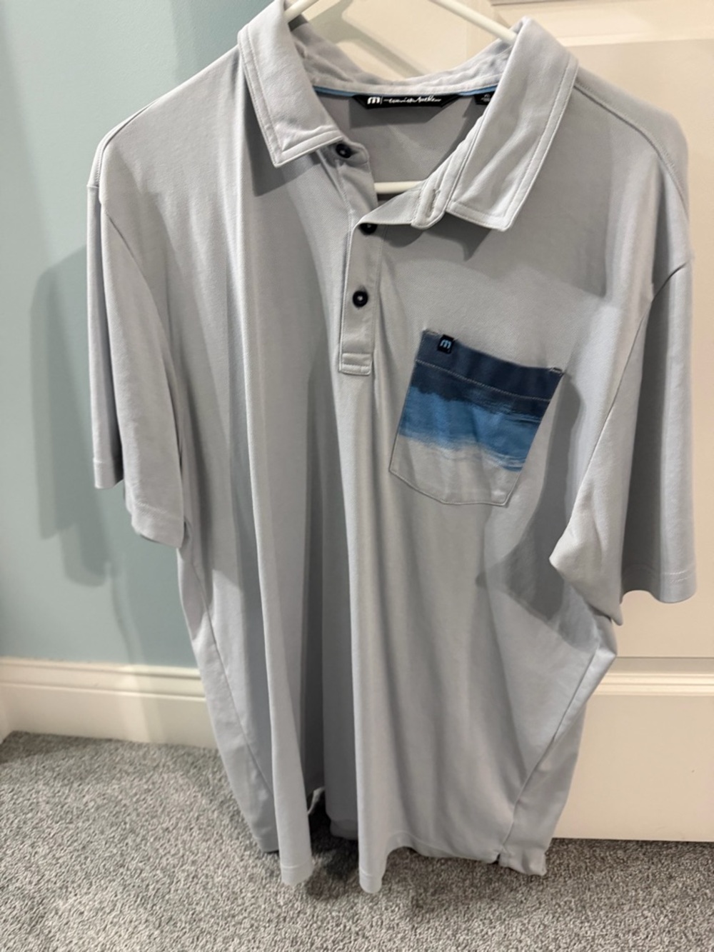 Travis Mathew Light Gray Polo with Blue Gradient Chest Pocket